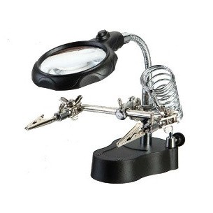 Mounting bracket with magnifying glass and LED backlight on a solid base